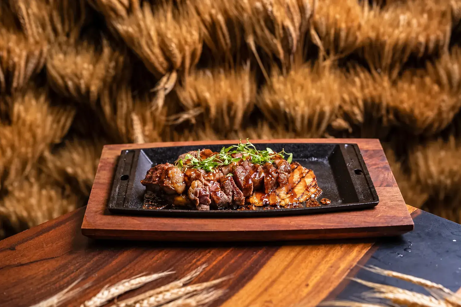 Kosher steak served on a wooden board at BACAR